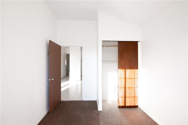 unfurnished bedroom featuring carpet floors and a closet