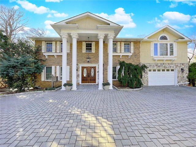 greek revival house with a garage