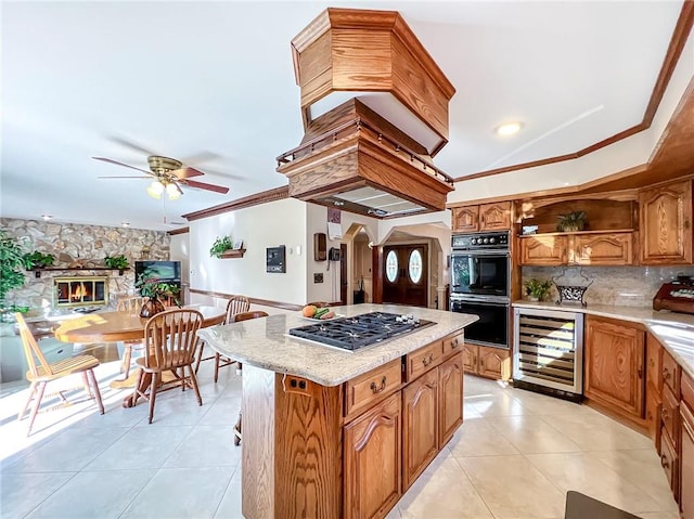 kitchen featuring a ceiling fan, open shelves, dobule oven black, stainless steel gas cooktop, and wine cooler