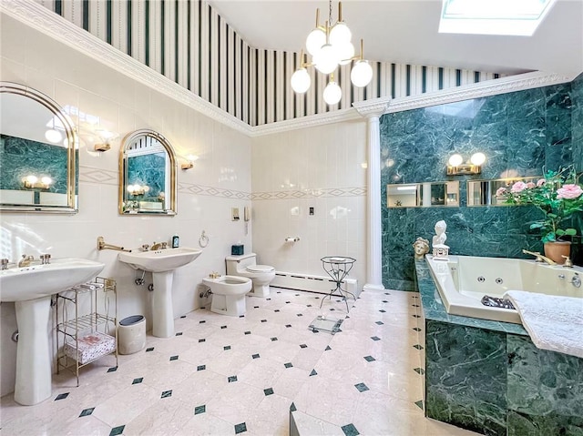 bathroom with a whirlpool tub, a baseboard radiator, a bidet, and tile walls