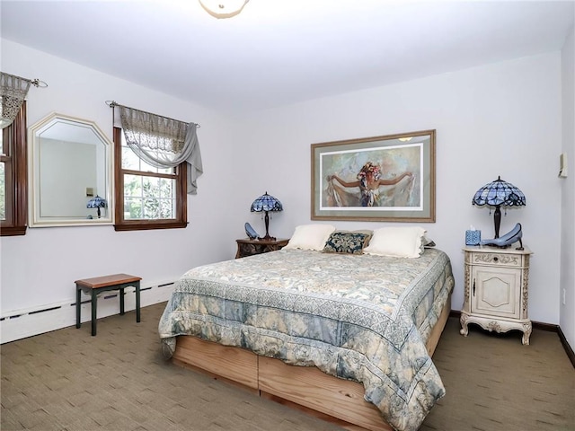 bedroom with carpet floors and baseboards