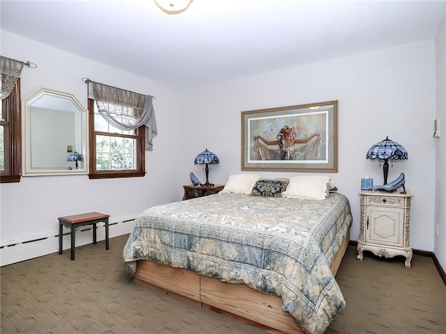 bedroom with baseboards and carpet