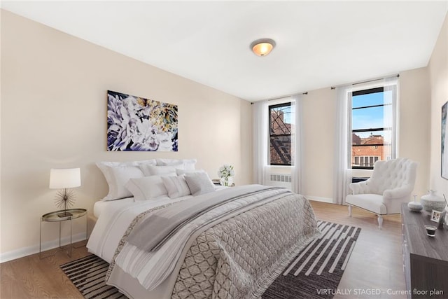 bedroom featuring hardwood / wood-style flooring