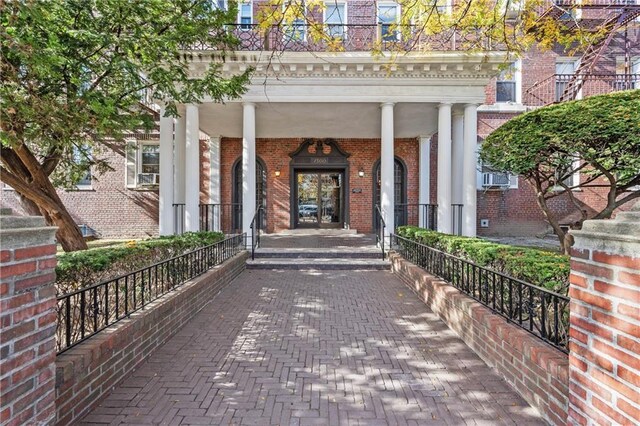 property entrance with covered porch