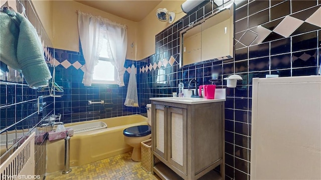 full bathroom featuring vanity, bathtub / shower combination, tile patterned floors, toilet, and tile walls