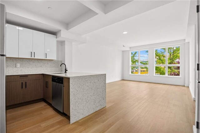 kitchen with dishwasher, sink, light hardwood / wood-style flooring, dark brown cabinets, and white cabinetry