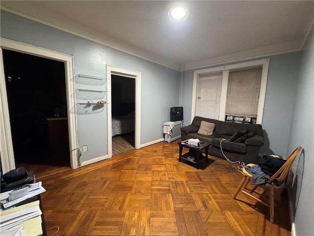 living room with ornamental molding and light parquet flooring