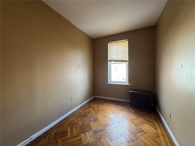 unfurnished room featuring light parquet flooring