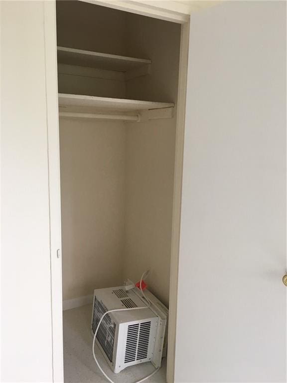 closet with an AC wall unit