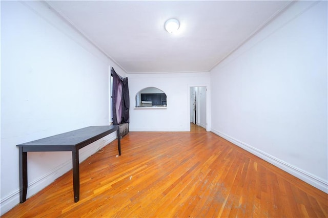 unfurnished room with hardwood / wood-style floors