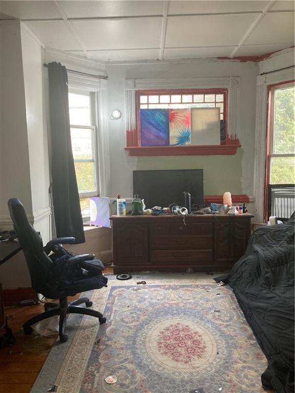 office space with plenty of natural light and a drop ceiling