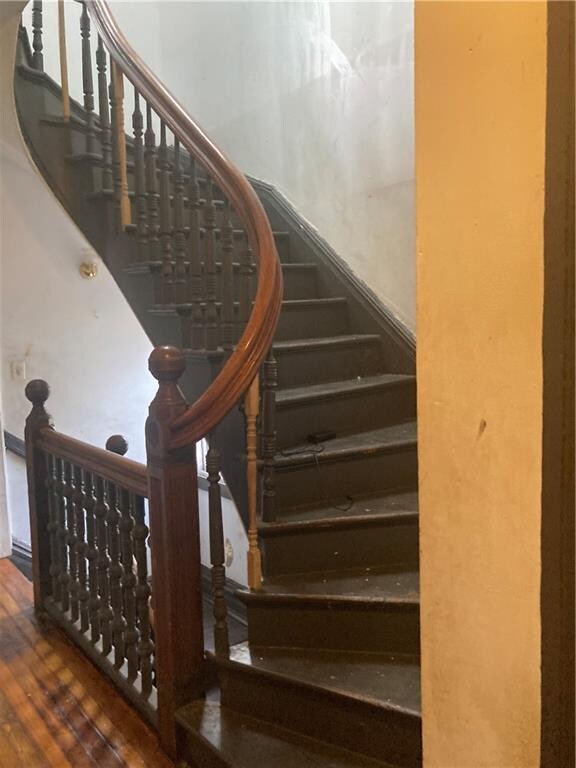 stairway with wood-type flooring