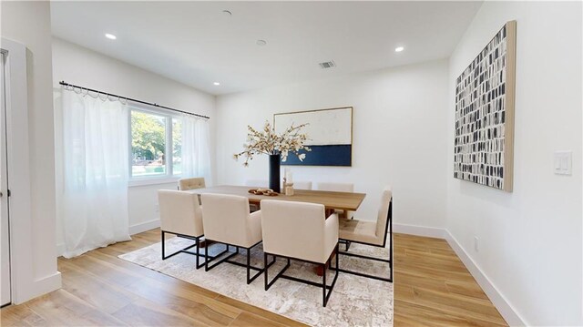 dining room featuring light hardwood / wood-style flooring