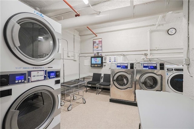 laundry area featuring independent washer and dryer and stacked washer and clothes dryer