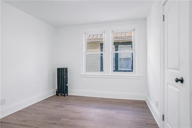 spare room featuring light hardwood / wood-style floors