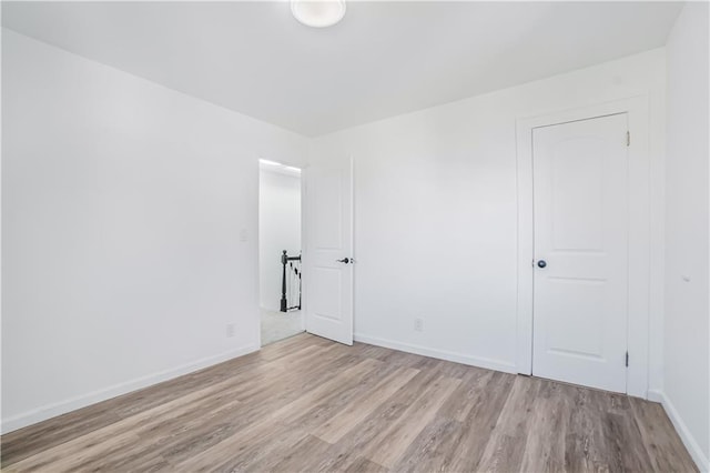 spare room featuring light wood-type flooring