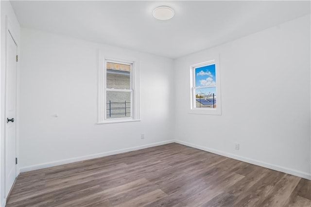 spare room featuring hardwood / wood-style flooring