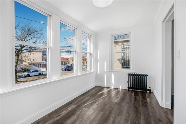 unfurnished sunroom with radiator