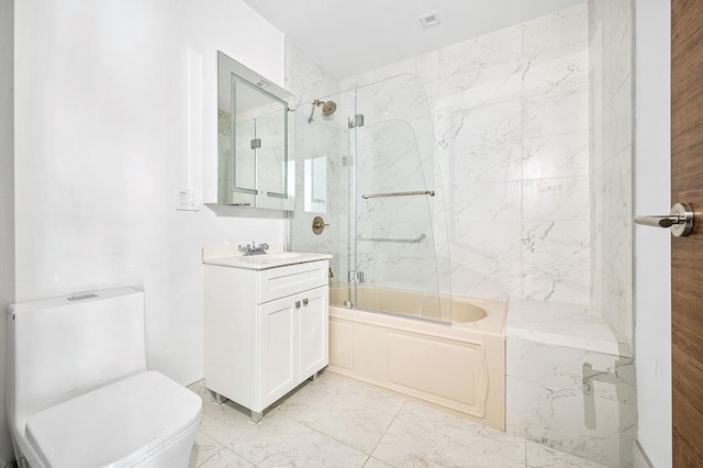 2335 Bath Ave Unit 1A, Brooklyn, NY 11214 - bathroom featuring vanity, marble look tiles, shower / bath combination with glass door, and toilet