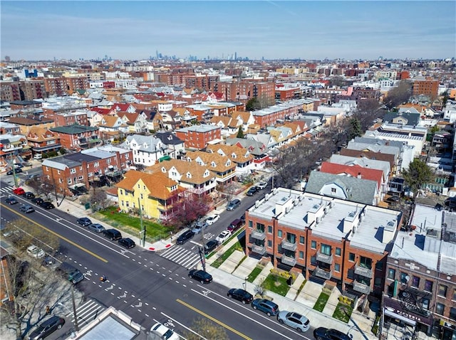 birds eye view of property featuring a city view