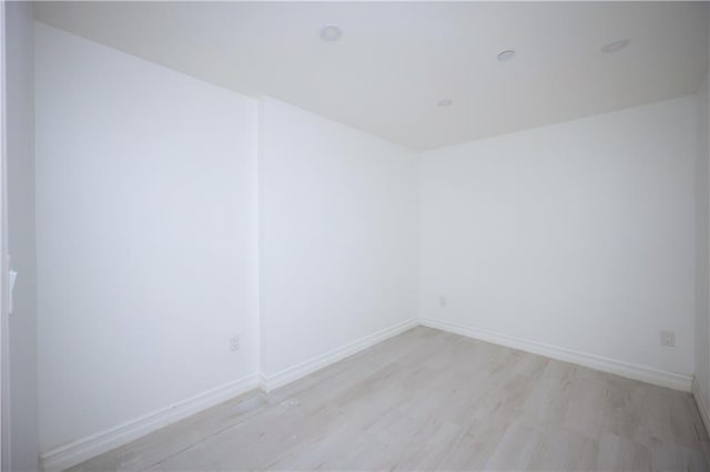 empty room with light hardwood / wood-style floors