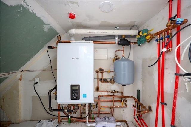 utility room featuring tankless water heater