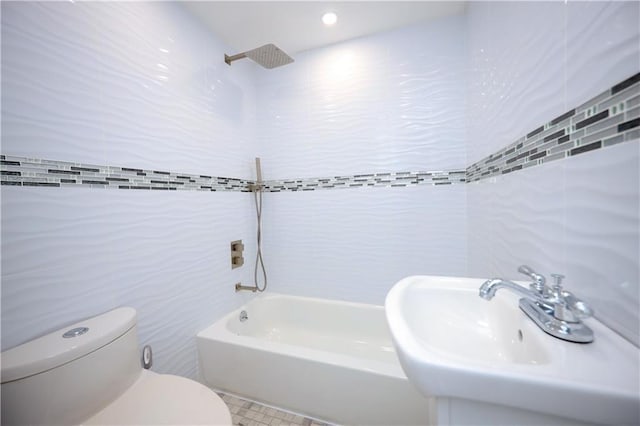 full bathroom featuring sink, shower / bath combination, tile walls, and toilet