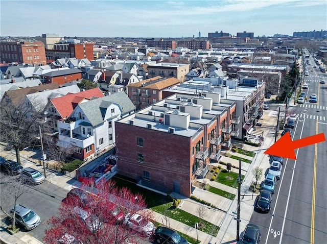 birds eye view of property with a city view