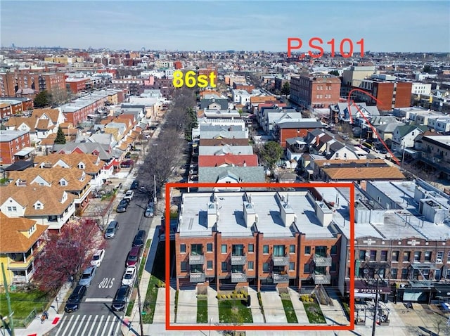 birds eye view of property with a view of city