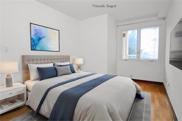 bedroom with wood finished floors