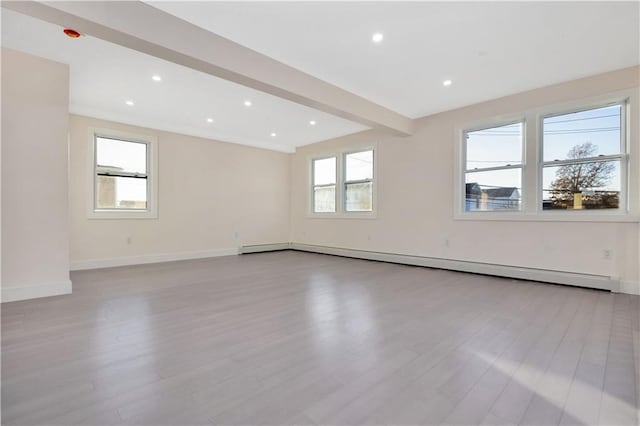 unfurnished room featuring light wood-style flooring, recessed lighting, a baseboard heating unit, baseboards, and beam ceiling