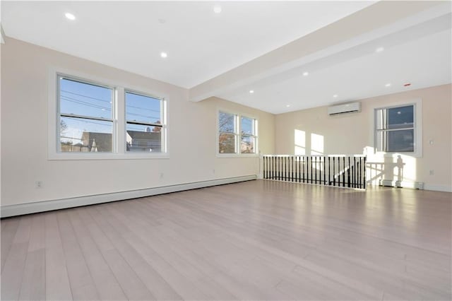 unfurnished room with a baseboard radiator, light wood-type flooring, a wall mounted AC, beam ceiling, and recessed lighting