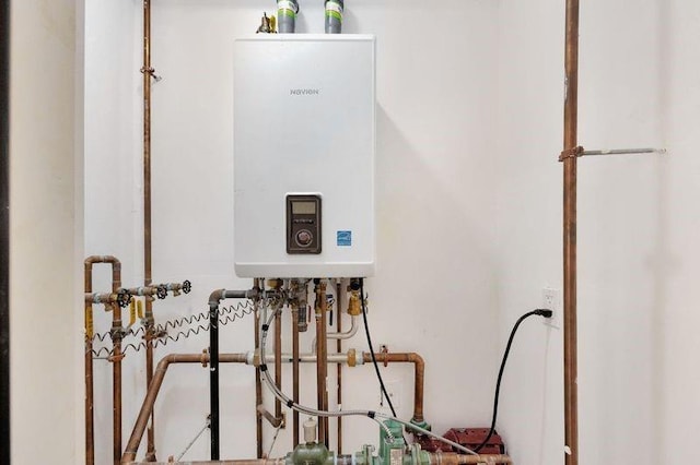 utility room with tankless water heater