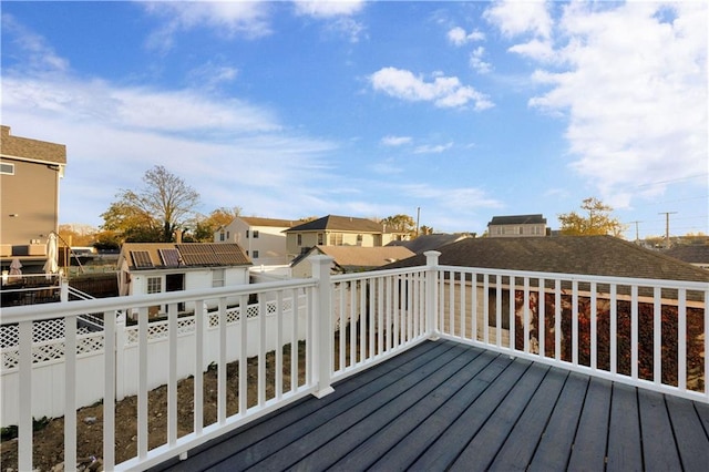 wooden terrace featuring a residential view