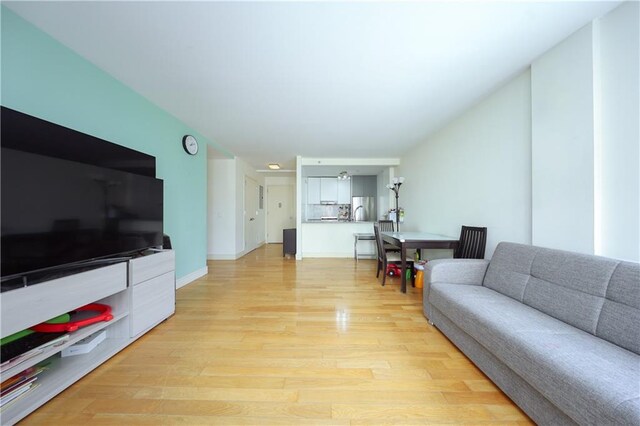 living room with light hardwood / wood-style floors