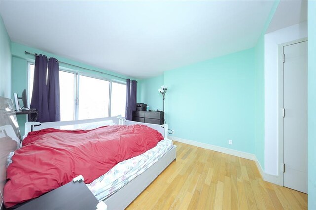 bedroom with light wood-type flooring