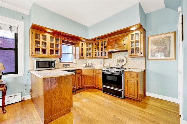 kitchen featuring kitchen peninsula, backsplash, a baseboard radiator, gas range, and dishwasher