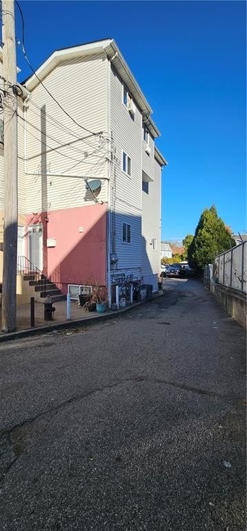 view of property featuring fence and entry steps