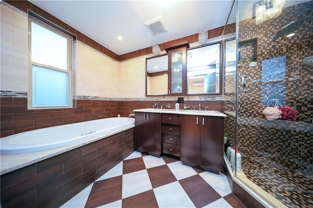 full bath featuring tile patterned floors, visible vents, a sink, a shower stall, and a bath