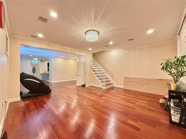 interior space featuring ornamental molding and hardwood / wood-style floors