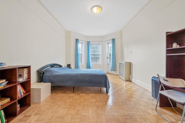 bedroom featuring light parquet flooring