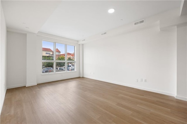 spare room with light hardwood / wood-style floors