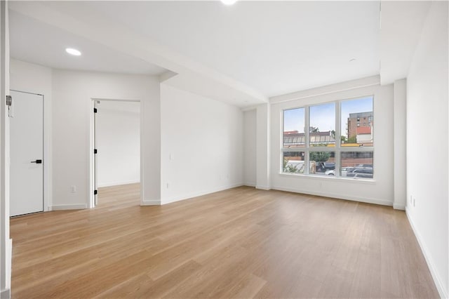 unfurnished room featuring light hardwood / wood-style floors