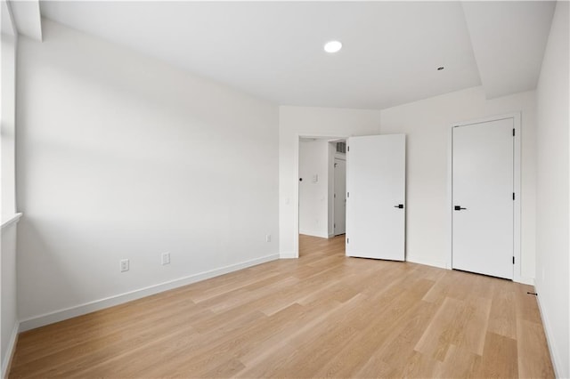 unfurnished bedroom with light hardwood / wood-style floors