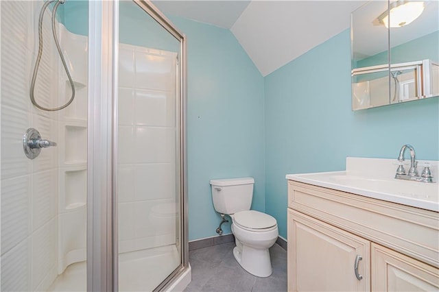 bathroom featuring a shower stall, vaulted ceiling, toilet, vanity, and baseboards