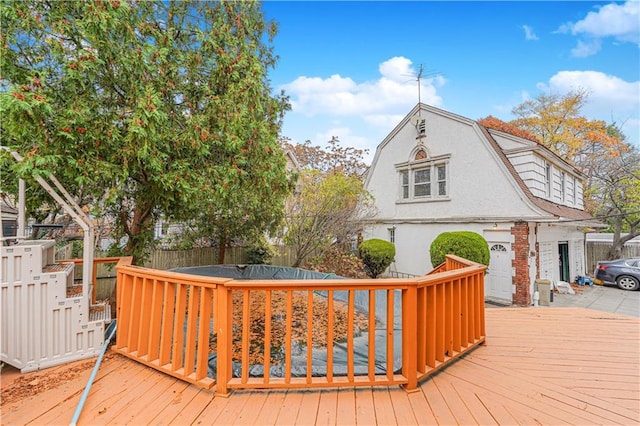 wooden deck featuring fence