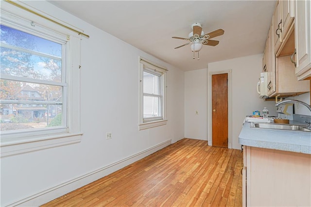 33 Wellington Ct, Brooklyn, NY 11230 - kitchen featuring a baseboard radiator, a sink, and healthy amount of natural light