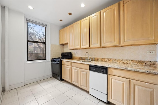 kitchen featuring dishwasher, light brown cabinets, backsplash, sink, and black gas range oven