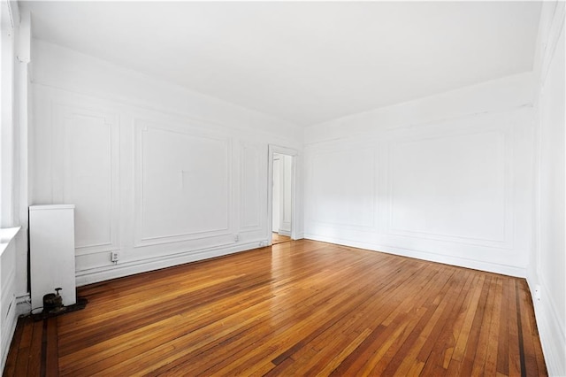 spare room featuring hardwood / wood-style floors