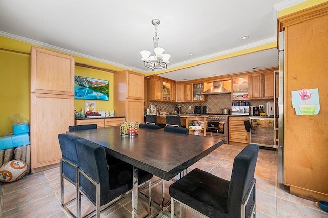 dining space featuring a chandelier, crown molding, and light tile patterned flooring